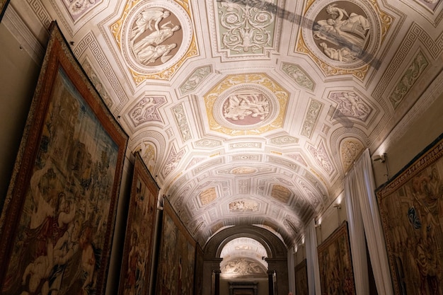 A long hallway with paintings on the walls