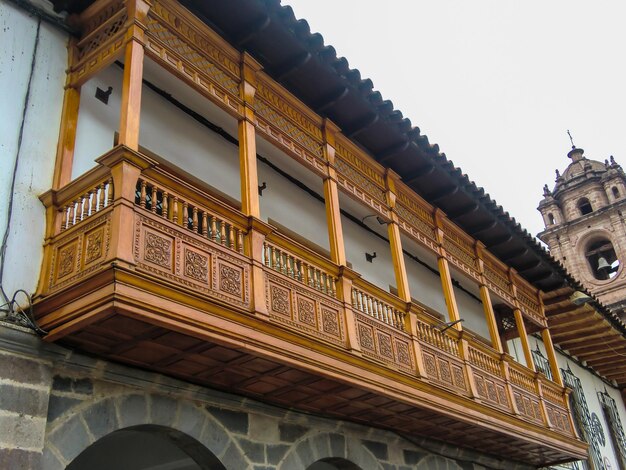 A long restored old colonial wooden balcony.