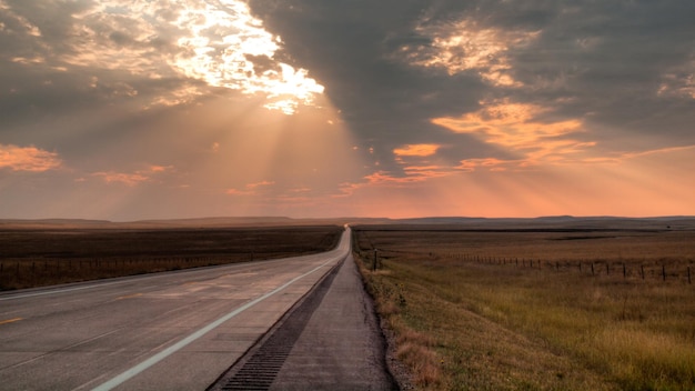 Long road at the sunset in South Dakota.