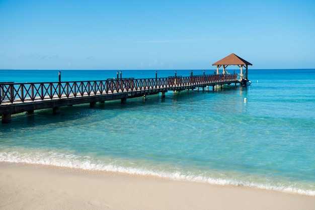 Long wooden jetty for ships, stretching into the sea