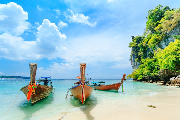 Longtale boat on the white beach at Phuket, Thailand. Phuket is a popular destination famous for its