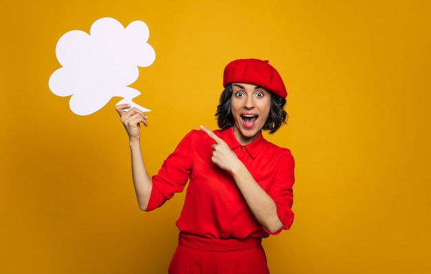 Look! I have an idea! young tourist, dressed in a parisian style, with red suit and a red beret, being excited about an idea about her journey.