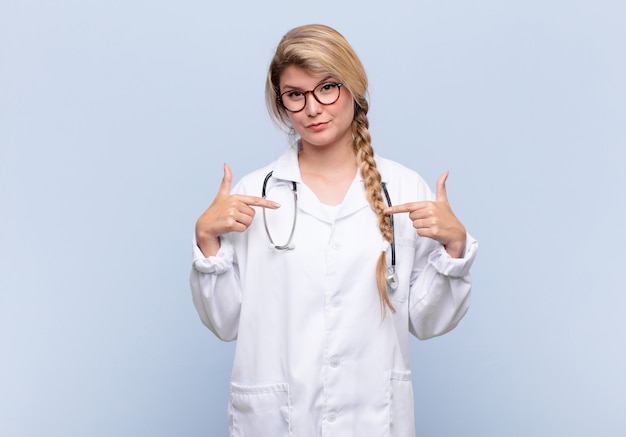 looking proud, positive and casual pointing to chest with both hands