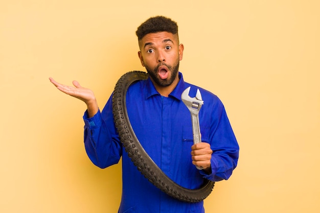 Photo looking surprised and shocked with jaw dropped holding an object