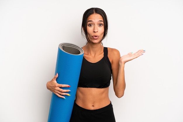 Looking surprised and shocked with jaw dropped holding an object