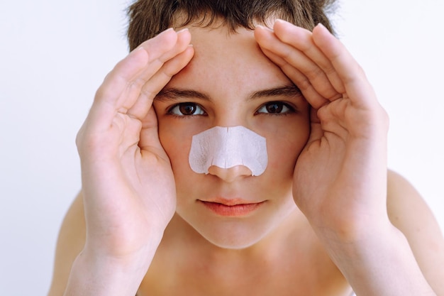 looking suspiciously at the camera of girl using cosmetic mask