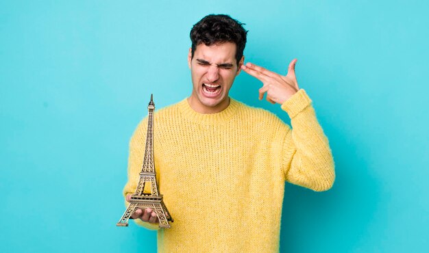 Photo looking unhappy and stressed suicide gesture making gun sign