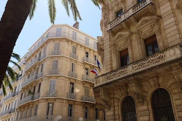 Looking up at the architectural details of an old apartment building in Toulon France