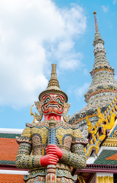 Looking up at giant statue at Grand palace, Temple of the Emerald Buddha (Wat pra kaew) in Bangkok ,Thailand.