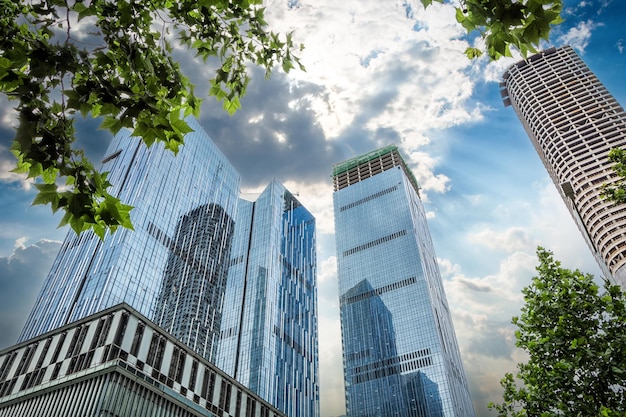 Looking up at modern urban commercial buildings