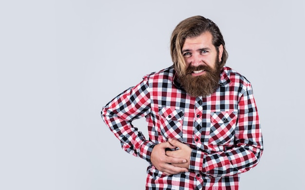 Looking very bad bearded man wear checkered shirt brutal man feeling pain male health care pain in heart mature hipster with beard has heartache brutal caucasian guy with moustache copy space