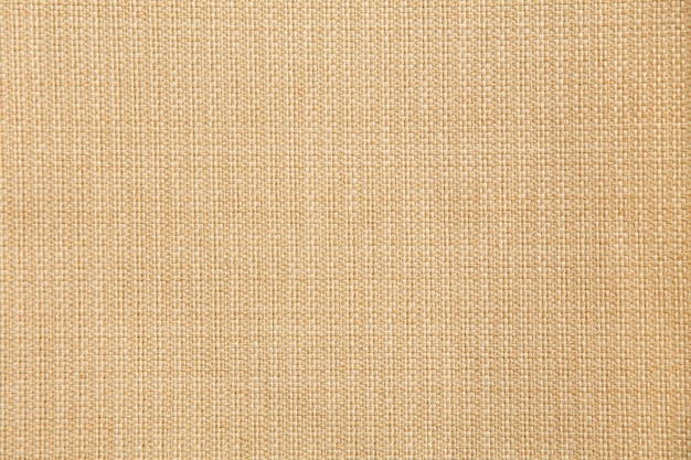 Looks sand color canvas type fabric texture as fabric background