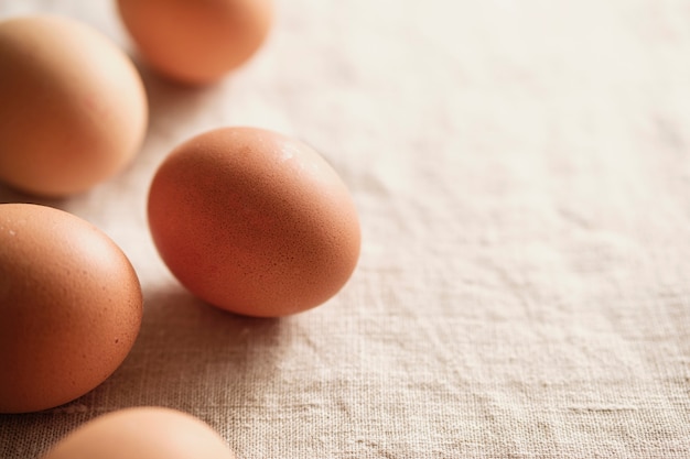 Loose fresh brown hens eggs on textile