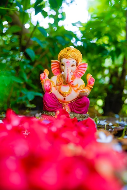 Lord ganesha sculpture on nature background