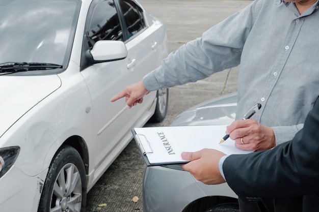 Loss Adjuster Insurance Agent Inspecting Damaged Car 
Sales manager giving advice