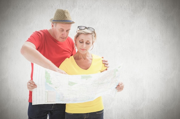 Photo lost tourist couple using map against white background