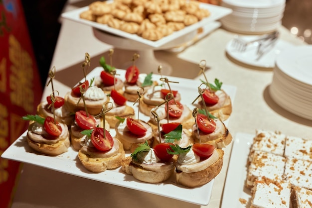 A lot of cold snacks on buffet table catering