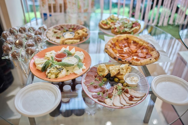 A lot of cold snacks on buffet table catering