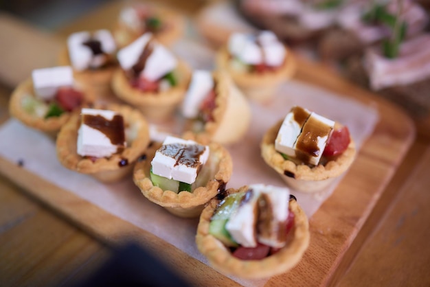 a lot of cold snacks on buffet table catering