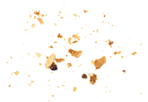 Photo a lot of crumbs of puff baked dough on a white isolated background