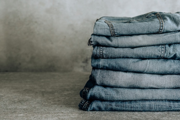 Lot of different blue jeans Blue Jeans, stack of jeans.