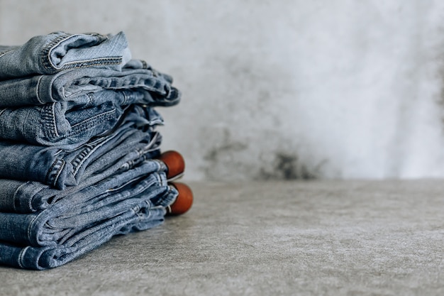 Lot of different blue jeans Blue Jeans, stack of jeans.