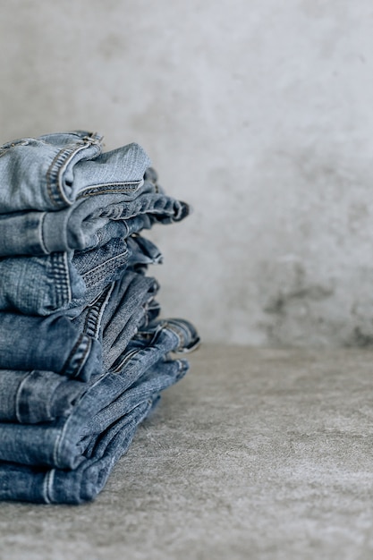 Lot of different blue jeans Blue Jeans, stack of jeans.