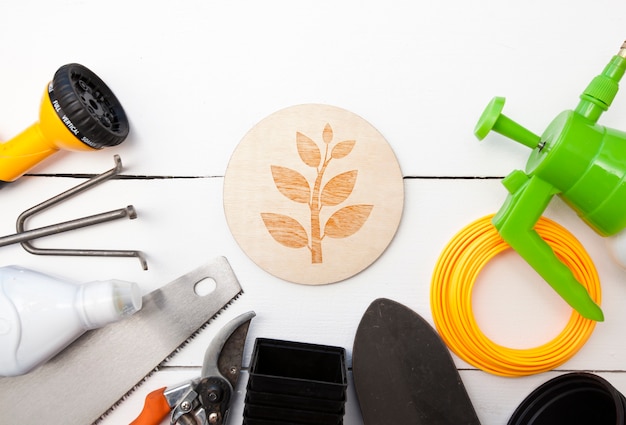 A lot of different garden equipment on the wooden table