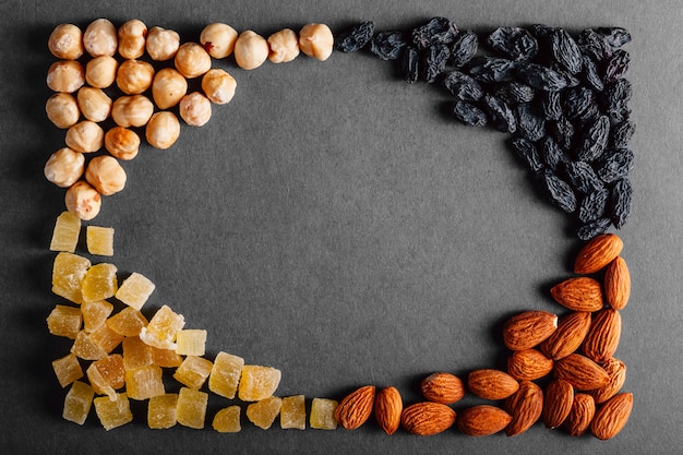 Lot of dried fruits on a black background