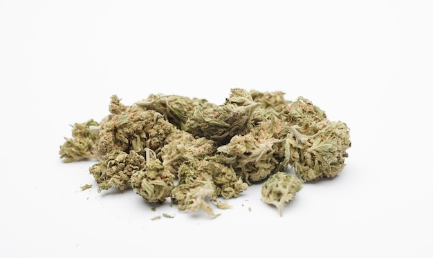 Lot of marijuana buds on white background