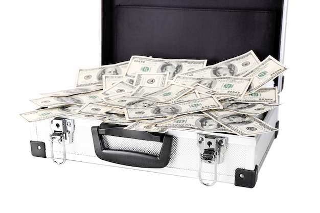 Lot of one hundred dollar bills in suitcase isolated on white