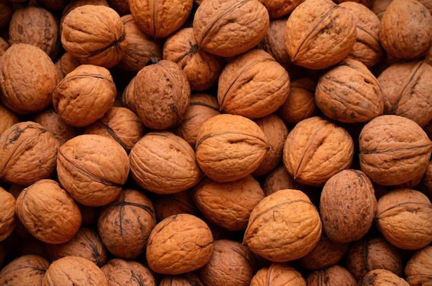 A lot of walnuts in the shell seamless background