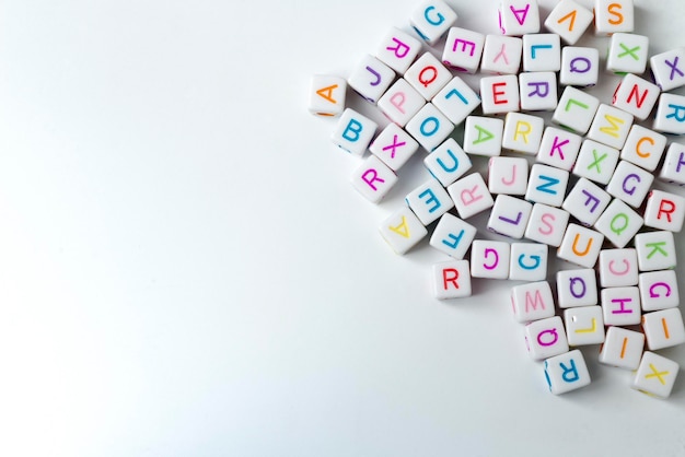 A lot of white cubes with letters on a white background