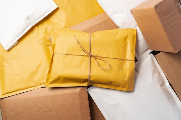 Lot of yellow paper postal envelopes top view