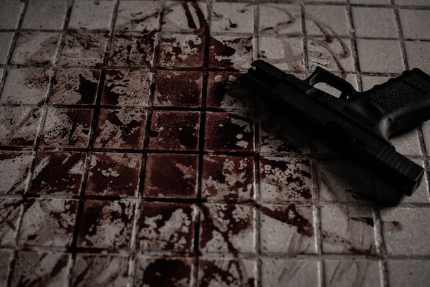 Lots of blood and guns on the floor Crime and suicide concept with guns