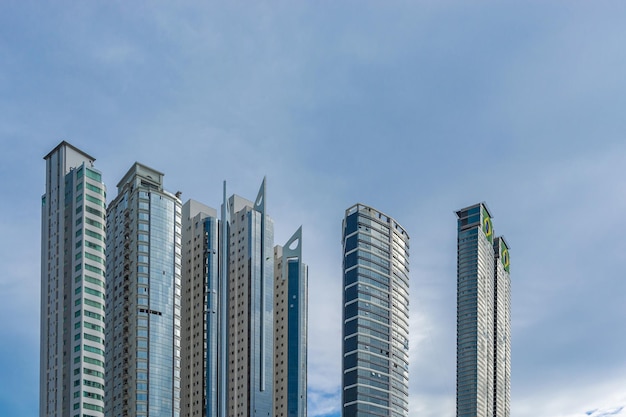 Lots of buildings skylines with bright blue sky on a sunny day