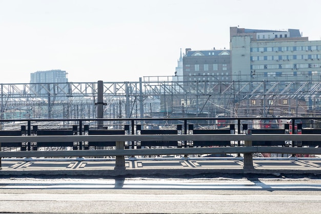 Lots of railway tracks with standing trains on a sunny day against a blue sky in an industrial city Top view