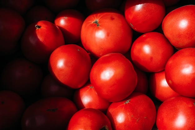 Lots of red ripe tomatoes at the farmers market counter