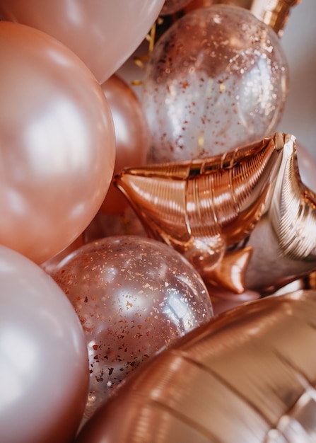 Lots of shiny pink balloons with helium