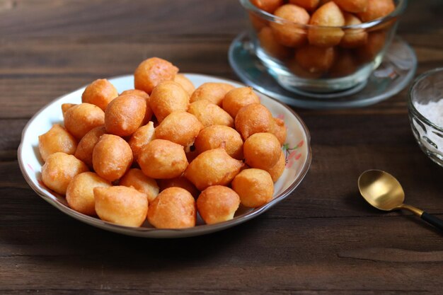 Loukoumades luqaimat or lokma with matcha sauce in a plate