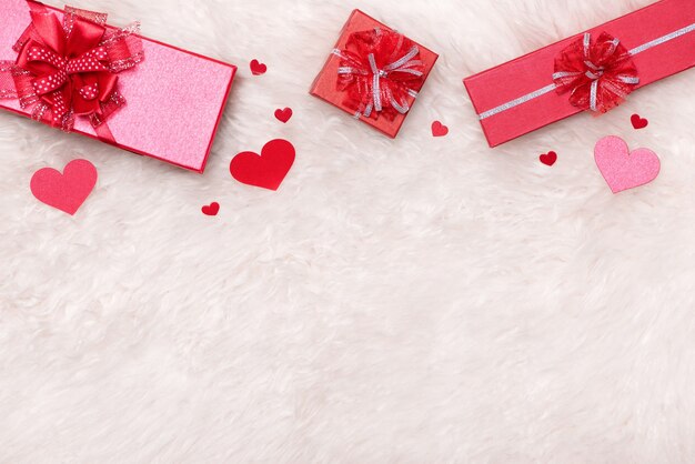 Love Concept. Top view of red gift boxes with bow.