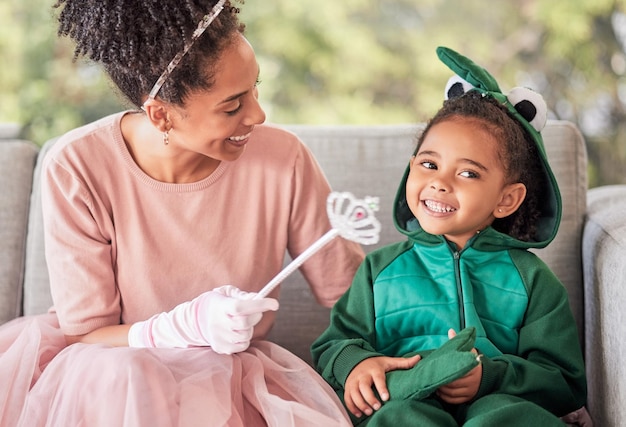 Love family costume and smile on happy girl child or kid playing dress up having fun and bonding with mother Happiness princess mom and dinosaur child enjoy quality time together for Halloween