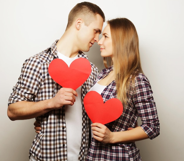 Love family and people concept Happy couple in love holding red heart