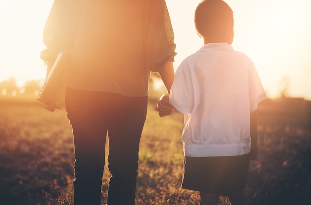 love parent ties mom with children hold one hand 