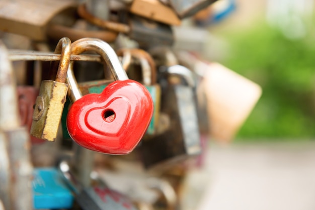 Love red romance lock with heart shape on the bridge