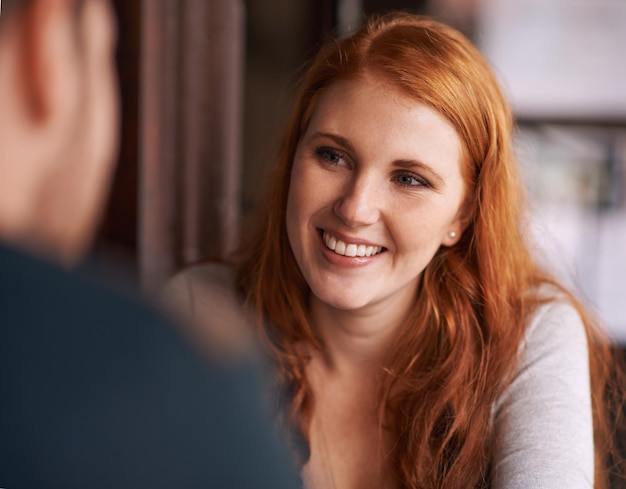 Love struck Shot of an attractive female smiling at her date