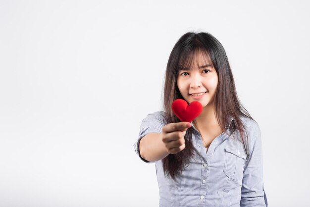 Love Valentine's Day. Woman beauty hands holding red heart for giving help donation medical healthcare concept isolated on white background, love holiday background concept