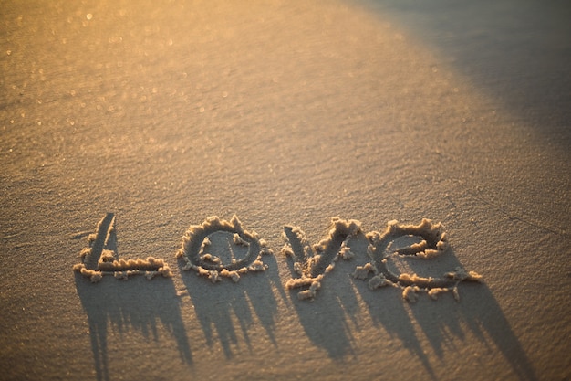 Photo love written on the beach