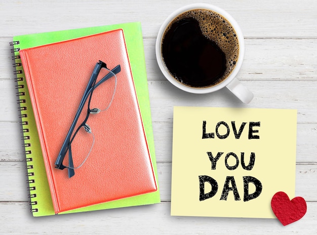 Love you dad letters written on sticky note