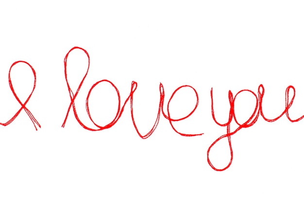 Love you words and heart symbol made of red thread isolated for your Valentine's day